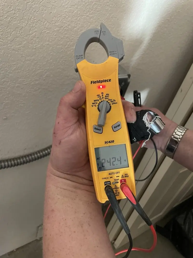 Voltage testing with clamp meter during Aluminum Wiring Replacement in Highland